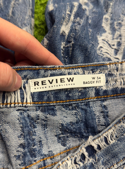 Spodnie jeansowe z efektem zdarcia Review